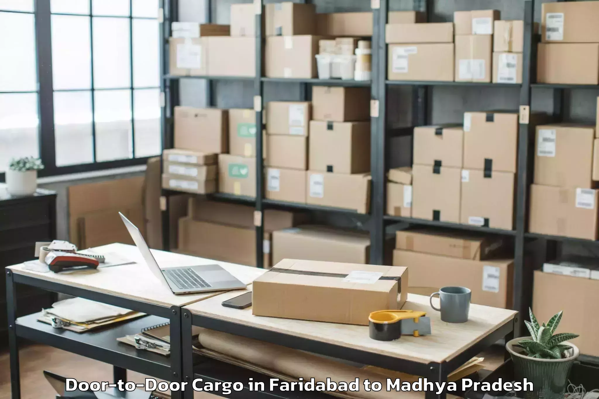 Book Faridabad to Mahidpur Door To Door Cargo